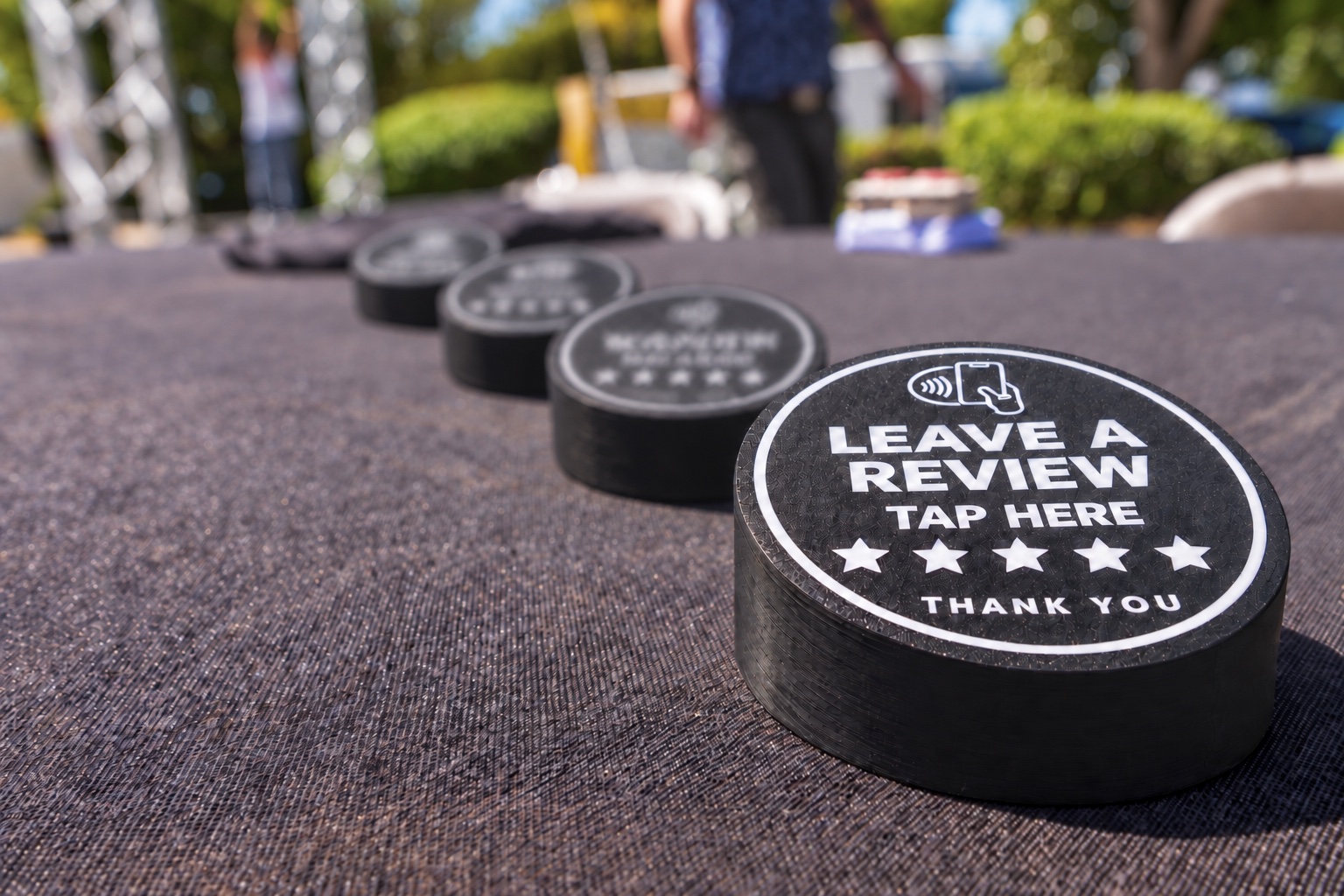 Real Valley Tap Reviews NFC pucks in use at a customer event